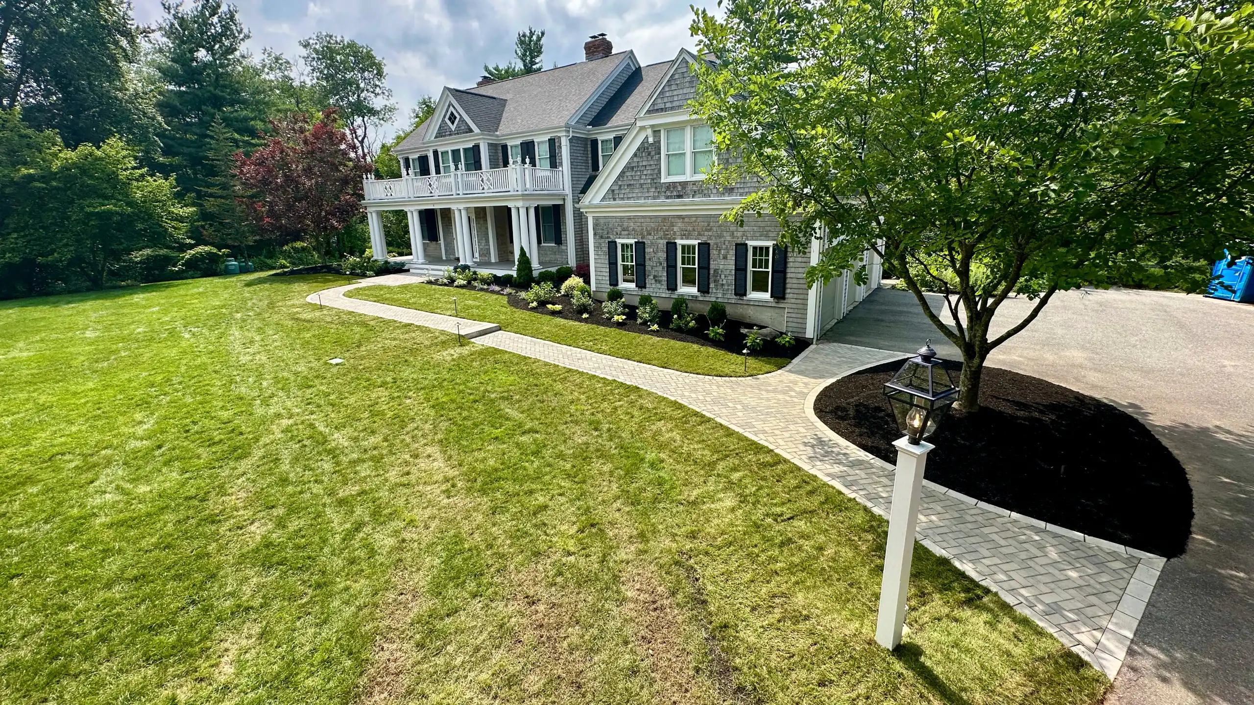 Custom paver walkway and front yard renovation designed and built by Outdoor Lifestyles