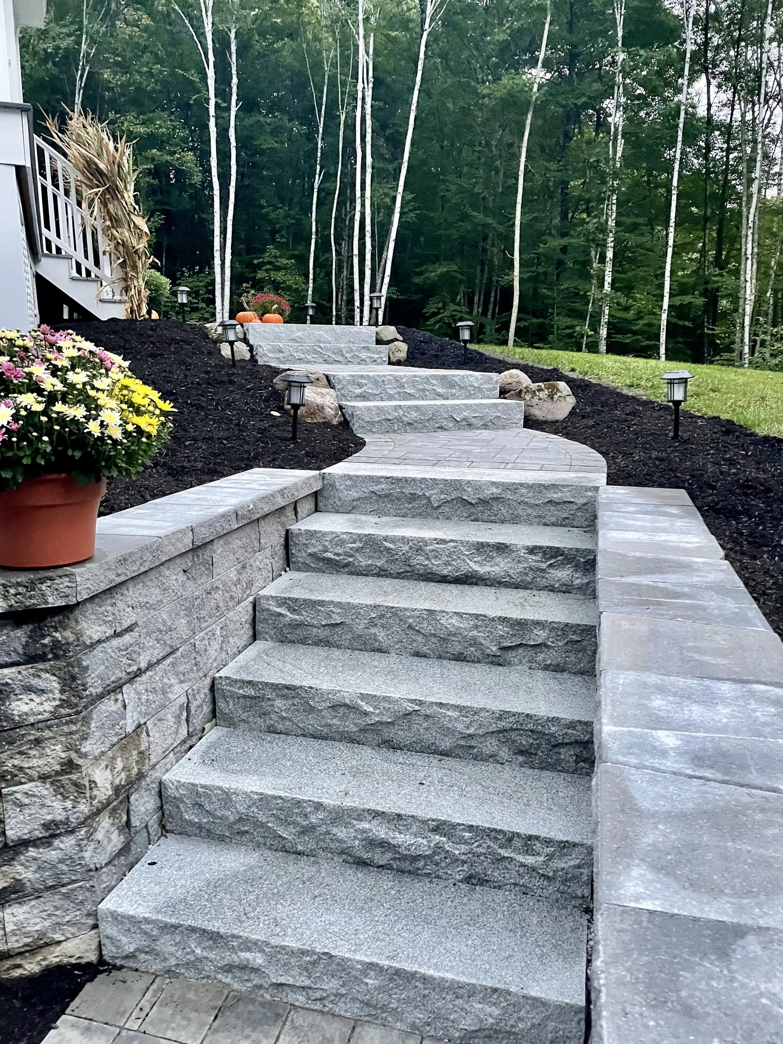 Massive solid granite steps providing a permanent transition between levels